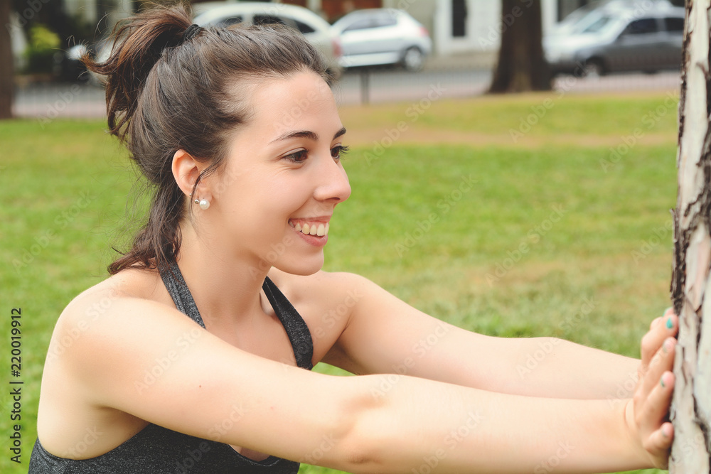 Portrair of young beautiful woman doing exercise at park Portrair of young beautiful woman doing exercise at park