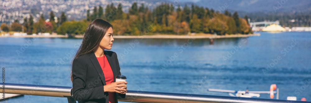 Asian business woman pensive drinking coffee at lunch break banner. Businesswoman relaxing outside at nature landscape panoramic crop. Asian business woman pensive drinking coffee at lunch break banner. Businesswoman relaxing outside at nature landscape panoramic crop.