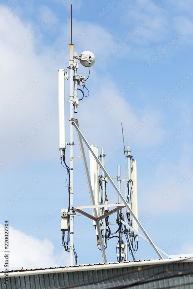 mobile antenna on a blue sky background mobile antenna on a blue sky background