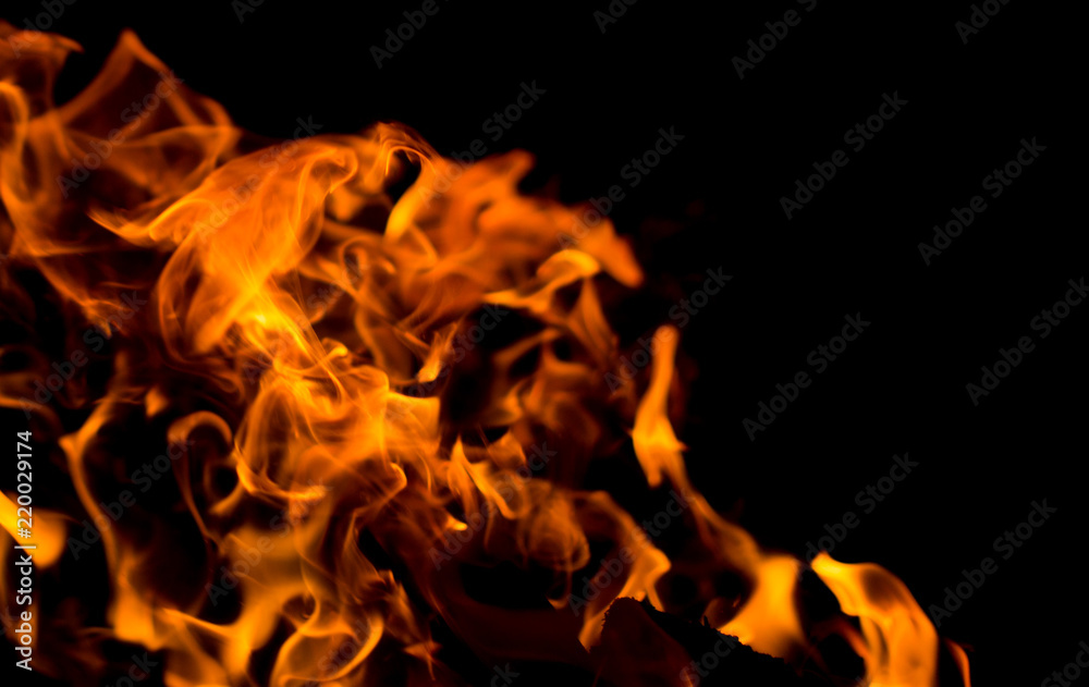 Flame of fire with sparks on a black background Flame of fire with sparks on a black background