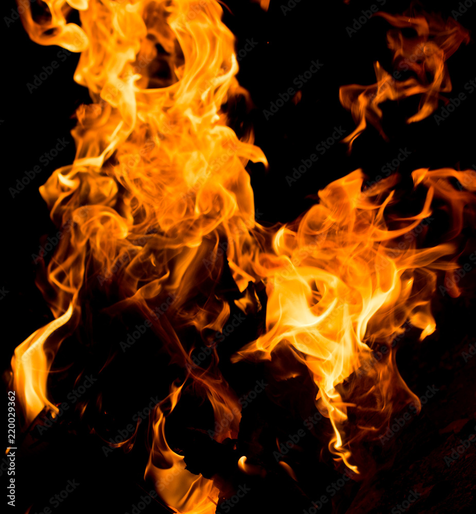Flame of fire with sparks on a black background Flame of fire with sparks on a black background