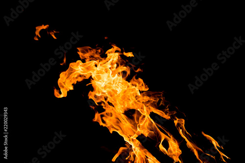 Flame of fire with sparks on a black background