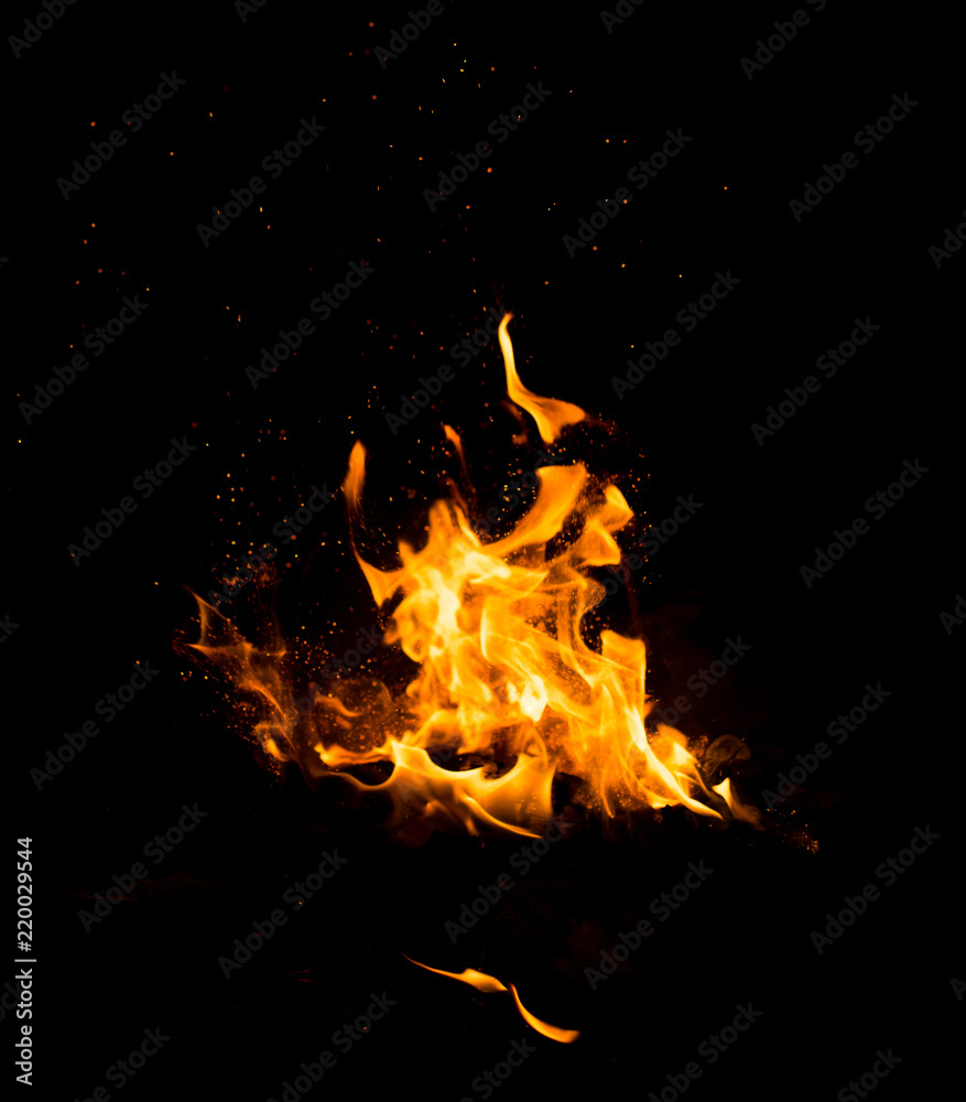 Flame of fire with sparks on a black background Flame of fire with sparks on a black background