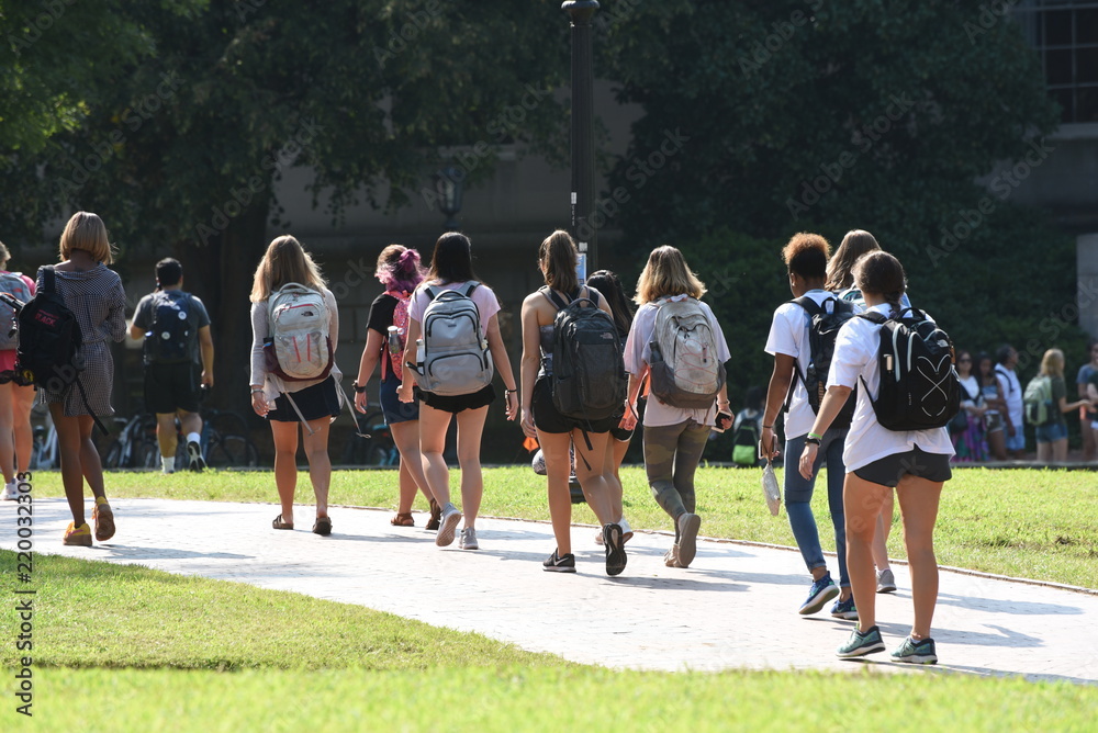 A group of female students walk across the campus of UNC Chapel Hill A group of female students walk across the campus of UNC Chapel Hill