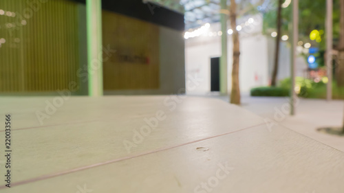 wood table on blur of view, shopping mall  background - can used for display or montage your products