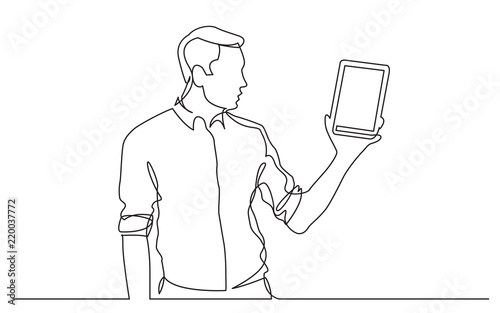 continuous line drawing of standing man showing tablet screen