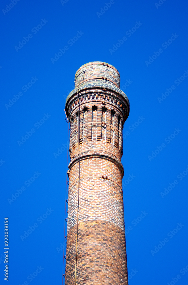 old brick chimney of an old factory