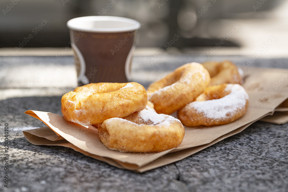 Doughnuts with sugar powder and coffee. Street food