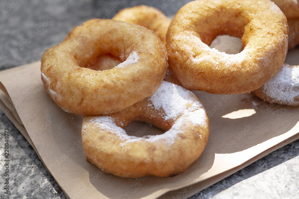 Doughnuts with sugar powder and coffee. Street food