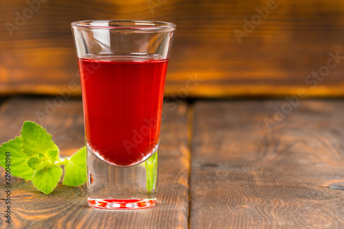 raspberry refreshing drink on wooden table