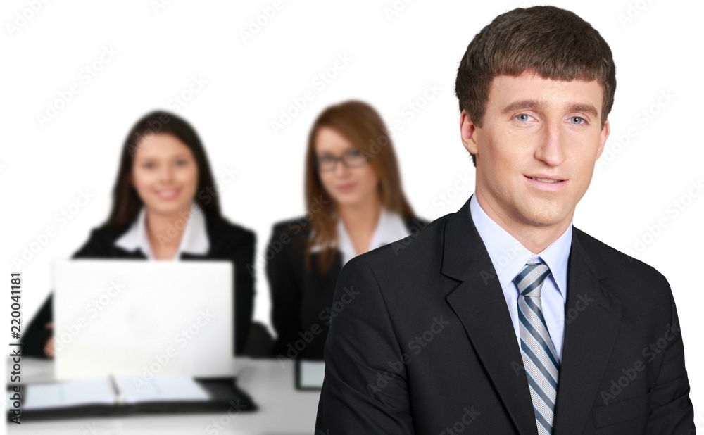 Young businessman and women working together in office isolated Young businessman and women working together in office isolated