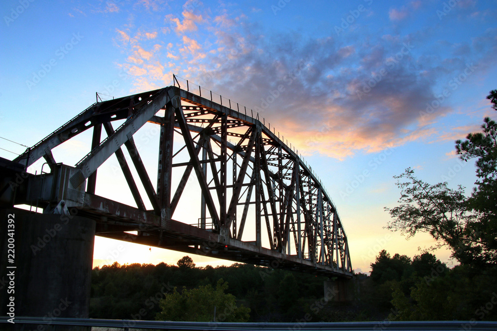 Railroad bridge at sunset