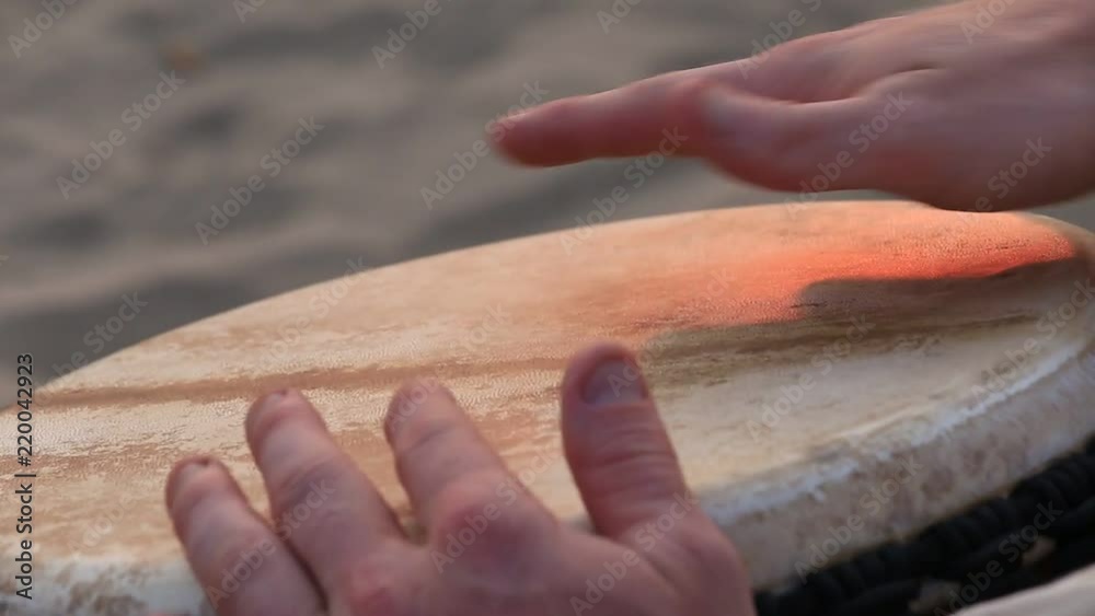 Man playing on a Bongo drum close up. Hand tapping a Bongo drum in close up. Drums hands, movement, rhythm. Goa state, Arambol beach. India
