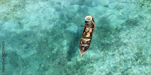 Fotografie, Obraz Fisherman in his boat  on turquoise sea