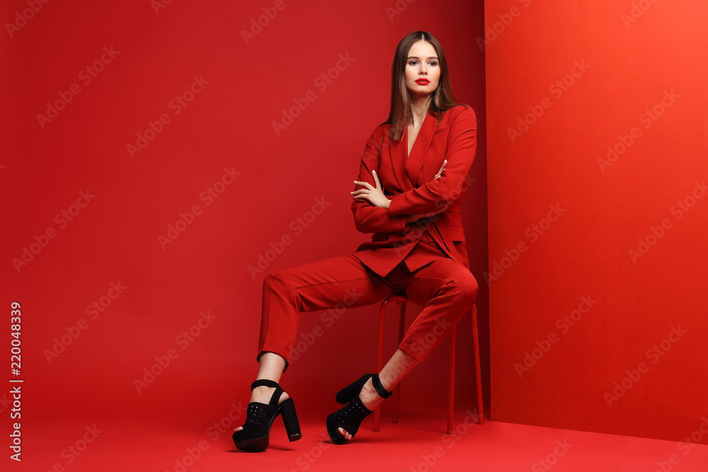 Fashion young woman in red suit. Fashion young woman in red suit.