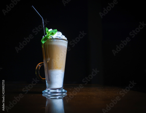 Coffee drinks on a black background. Coffee on a black table. Cold coffee. Latte. Cappuccino. Espresso. Coffee cocktails. Milkshakes. Whipped cream. Barista
