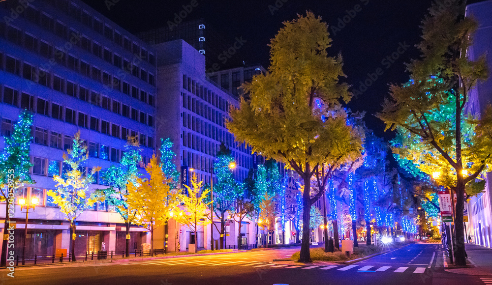 Midosuji Street, Osaka, Japan with night light illumination with many color of neon light show