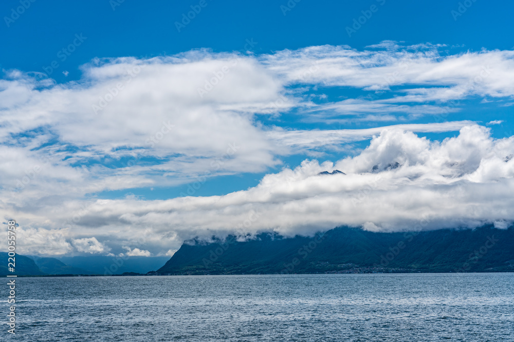Switzerland, scenic view on Alps with fog, clouds near lake Leman