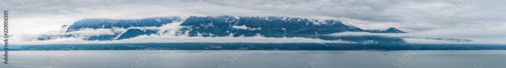 Switzerland, scenic view on Alps with fog, clouds near lake Leman