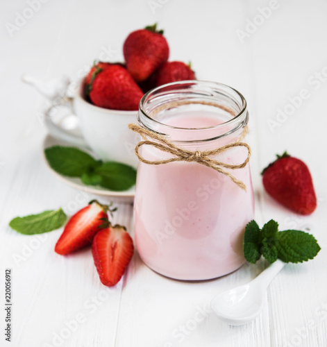 Jar with strawberry yogurt