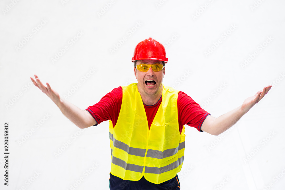 Confused factory worker expressing anger looking up in his boss with arms wide opened Confused factory worker expressing anger looking up in his boss with arms wide opened