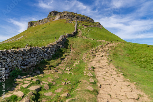 Yorkshire Dales landscape on the Pennine Way between Halton Gill and Horton in Ribblesdale with the Pen-Y-Ghent in the background, North Yorkshire, England, UK