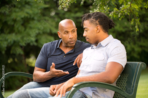 Mature man mentoring and giving advice to a younger man.