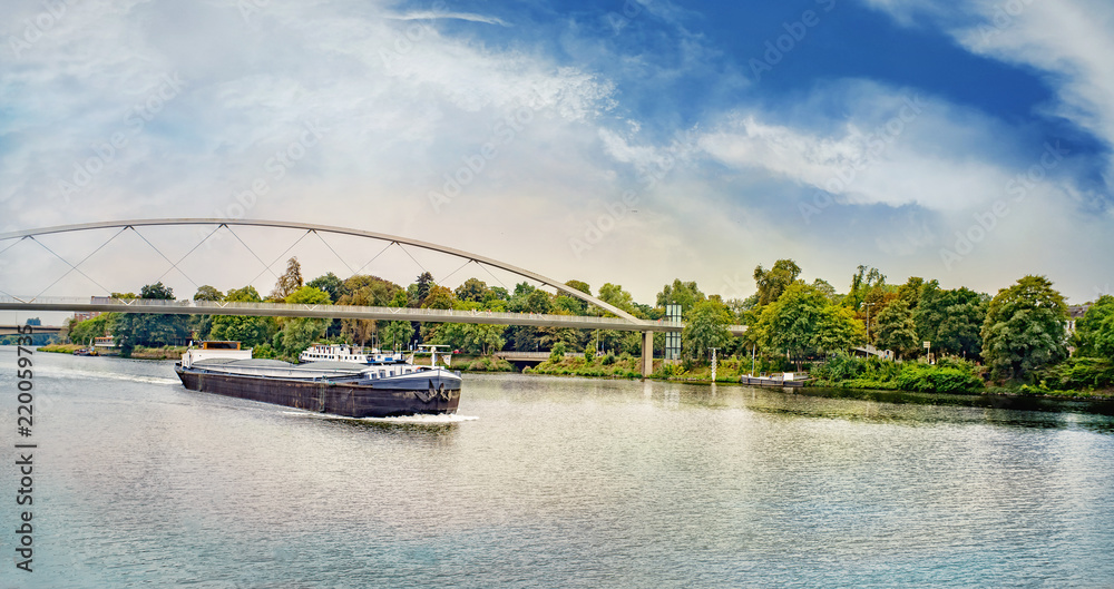 Fototapeta premium Barge under the Hoger Brug (Higher Bridge) on the River Maas