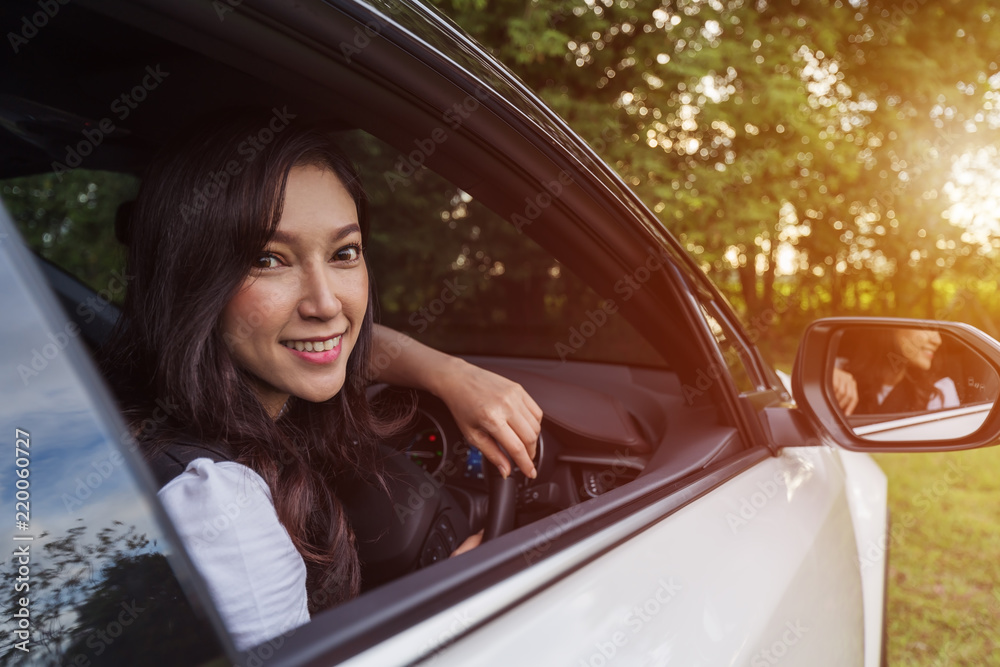 happy young woman in car