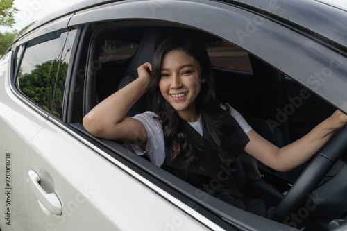 happy young woman in car