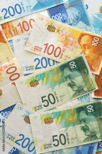 Israeli money stack of the new Israeli money bills (banknotes) of 50, 100 and 200 shekel. New Israeli Shekel series C.Israeli money notes
