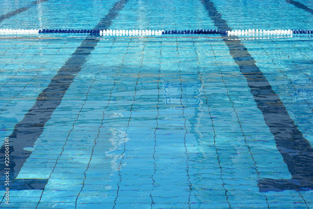Lanes of a competition swimming pool. Empty swimming pool with lanes. Empty swimming pool with lanes.