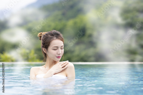 Young woman relaxing in hot springs