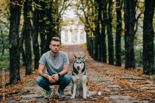young man with husky dog in autumn park © LIGHTFIELD STUDIOS