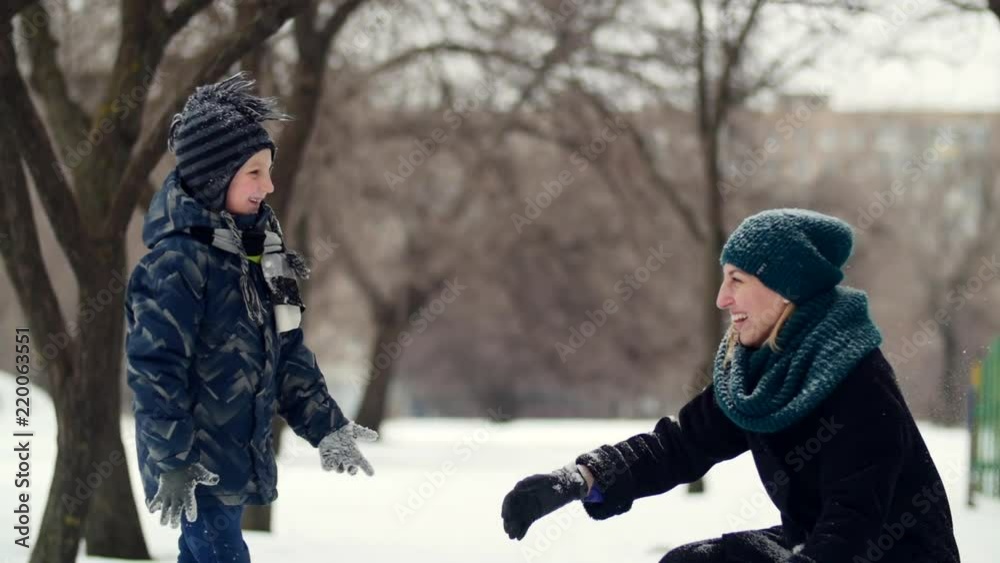 HD Mother and child throw the snow on each other HD Mother and child throw the snow on each other