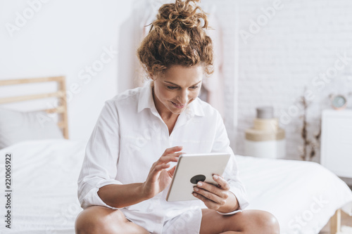 Woman Using Tablet at Home photo