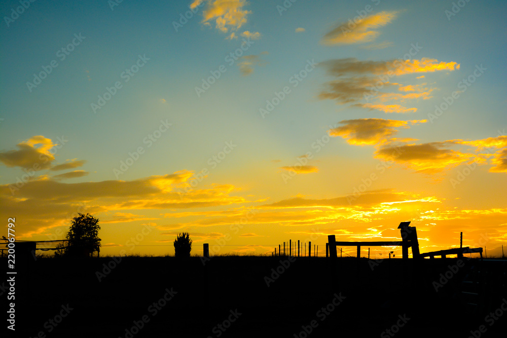 Golden sunset over rural countryside landscape