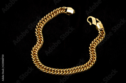 Golden chain on a dark pattern