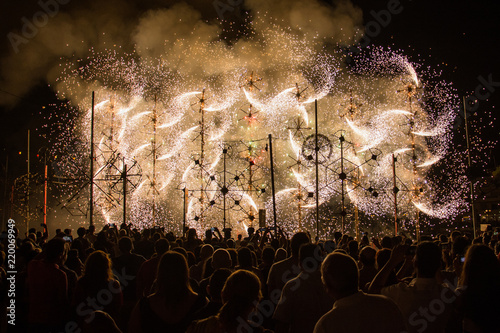 White ground fireworks and crowd watching them(Marsascala, Malta)