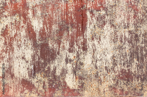 Rusty red metal texture background with cracked white paint. Abstract grungy texture pattern
