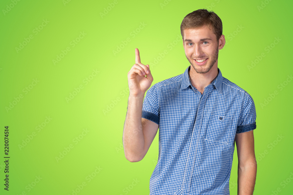 Young Man in glasses pointing up Young Man in glasses pointing up