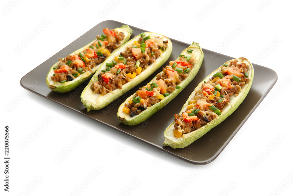 Plate with meat stuffed zucchini boats on white background Plate with meat stuffed zucchini boats on white background