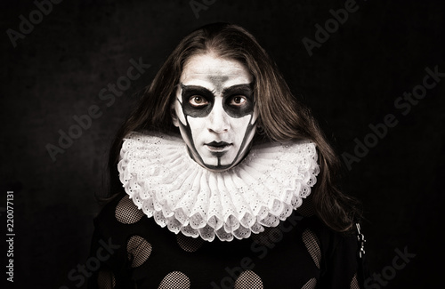 фотографія Portrait of man in goth style clothes and  ruff collar with scull makeup
