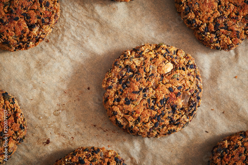 Vegan quinoa and bean burgers made with beans, quinoa, nori algae, oats, smoked peppers and onions photo