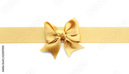 Golden ribbon with bow on white background