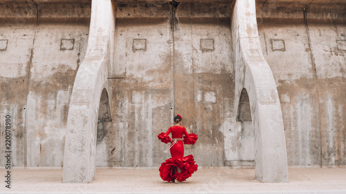 Woman dressed in red dancing flamenco in Malaga