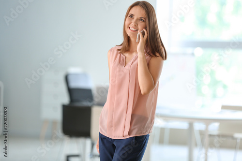 Young businesswoman talking...