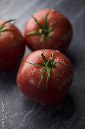 Organic tomatoes on table