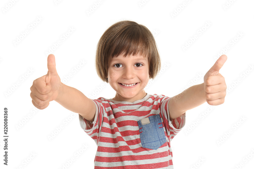Cute little boy showing thumb-ups gesture on white background Cute little boy showing thumb-ups gesture on white background