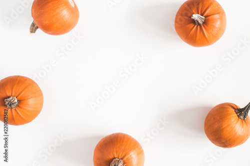 Autumn composition. Pumpkins on white background. Autumn, fall, halloween concept. Flat lay, top view, copy space